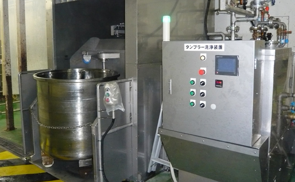タンブラータンク高圧洗浄装置（処理量15台/時間）